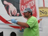 Finishing touches at the Salvation Army by artist Dave Petri 